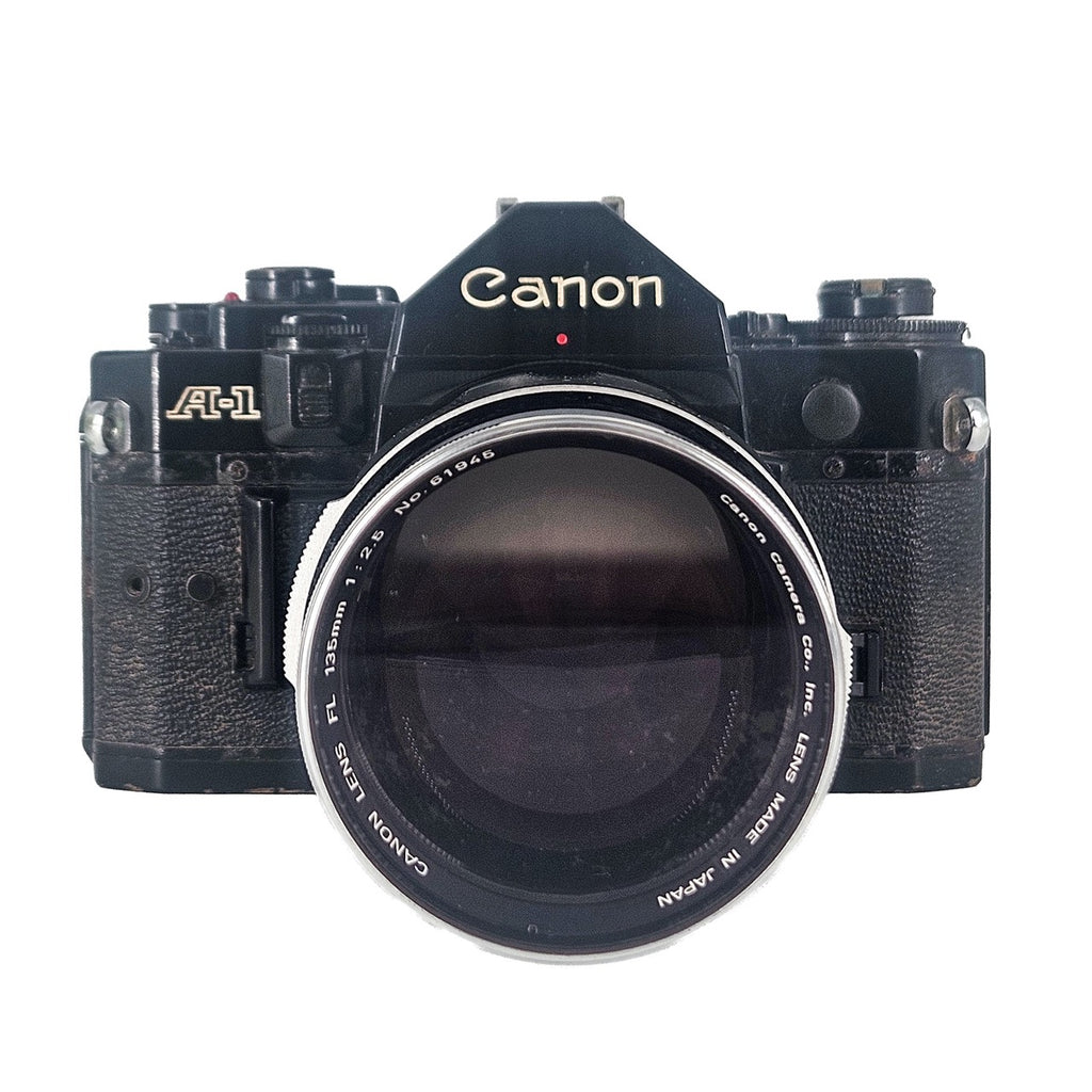 Canon A-1 + Canon FL 135mm f/2.5 | SLR Film Camera + Lens | Good